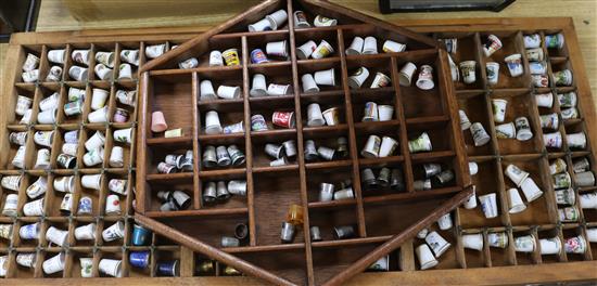 A collection of thimbles and thimble display units, books etc